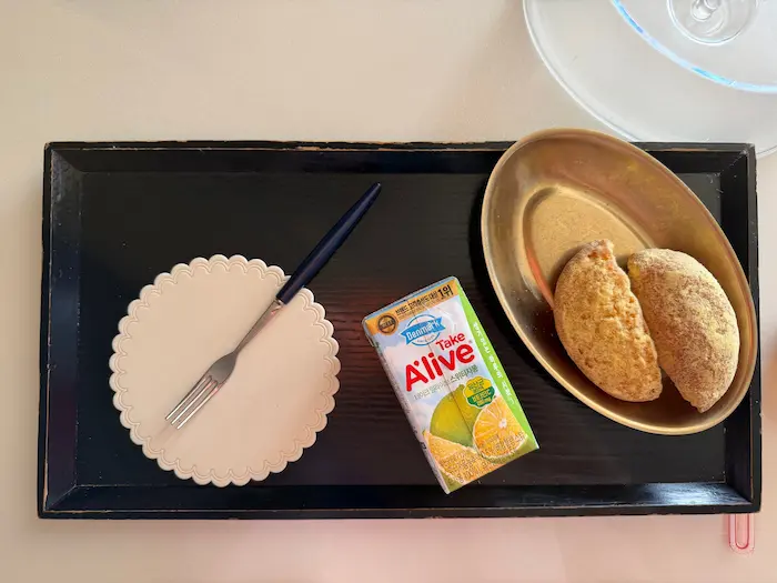 Bread and fruit juice snack served at a Korean Postpartum Care Center