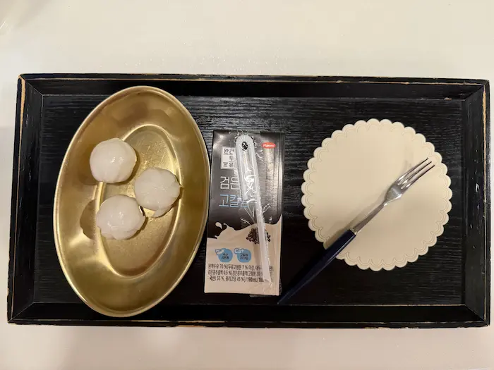 Rice cake snack and chocolate milk served at a Korean Postpartum Care Center