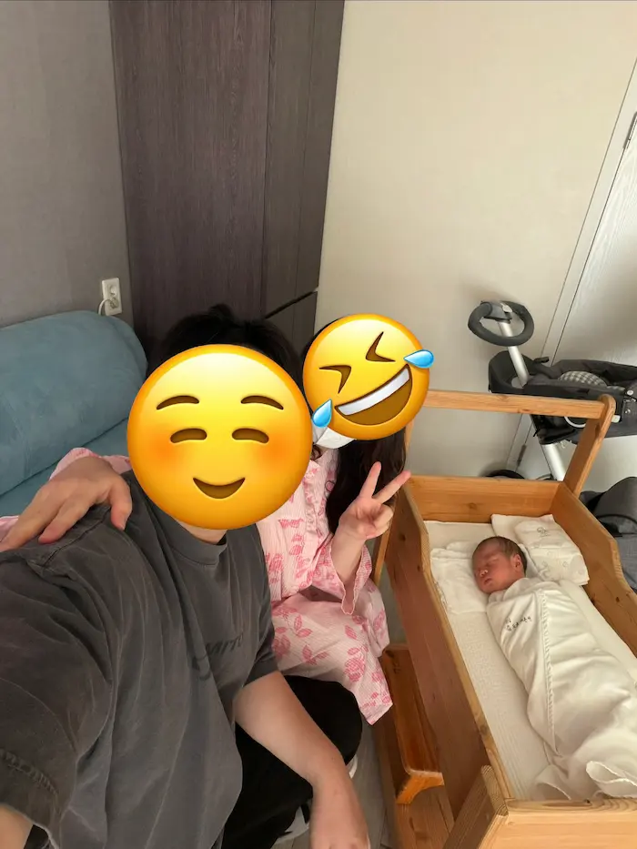 Parents spending time with their newborn during rooming-in at a Korean Postpartum Care Center