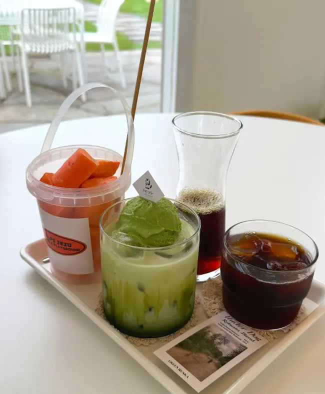 Signature coffee and matcha drinks served at Alps Jeju Cafe