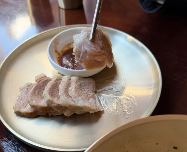 Tender boiled pork slices served at Myeon Seoul