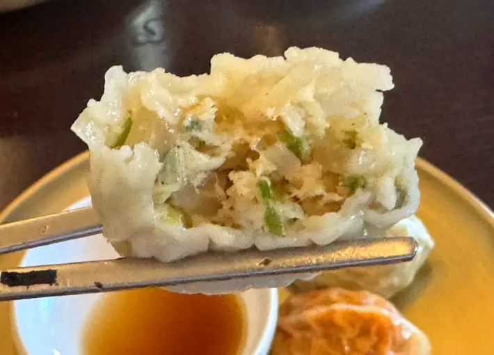 Close-up of handmade dumpling filling at Myeon Seoul