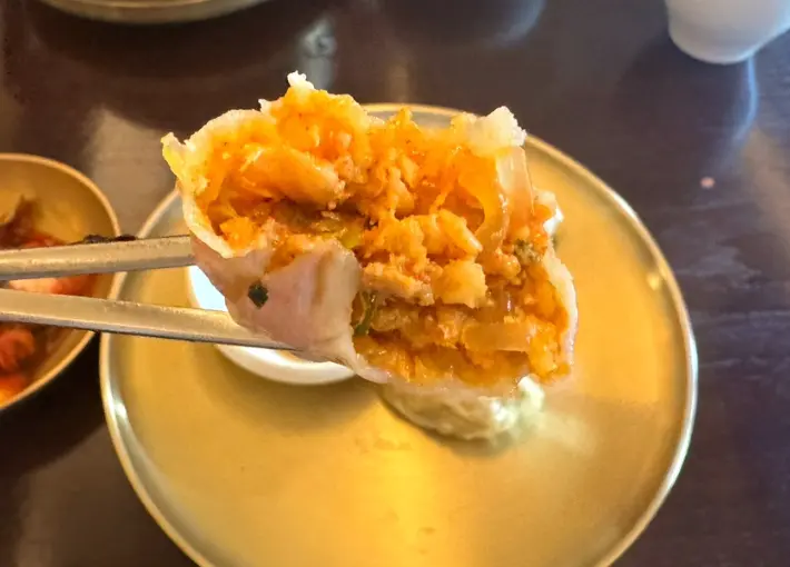 Close-up of kimchi dumpling filling at Myeon Seoul