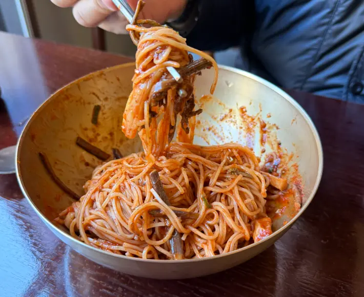 Close-up of spicy mixed noodles at Myeon Seoul